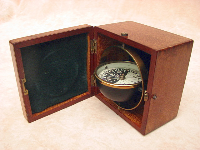 Antique gimbal mounted deck compass in mahogany case